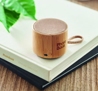 Logotrade advertising product picture of: Round bamboo wireless speaker